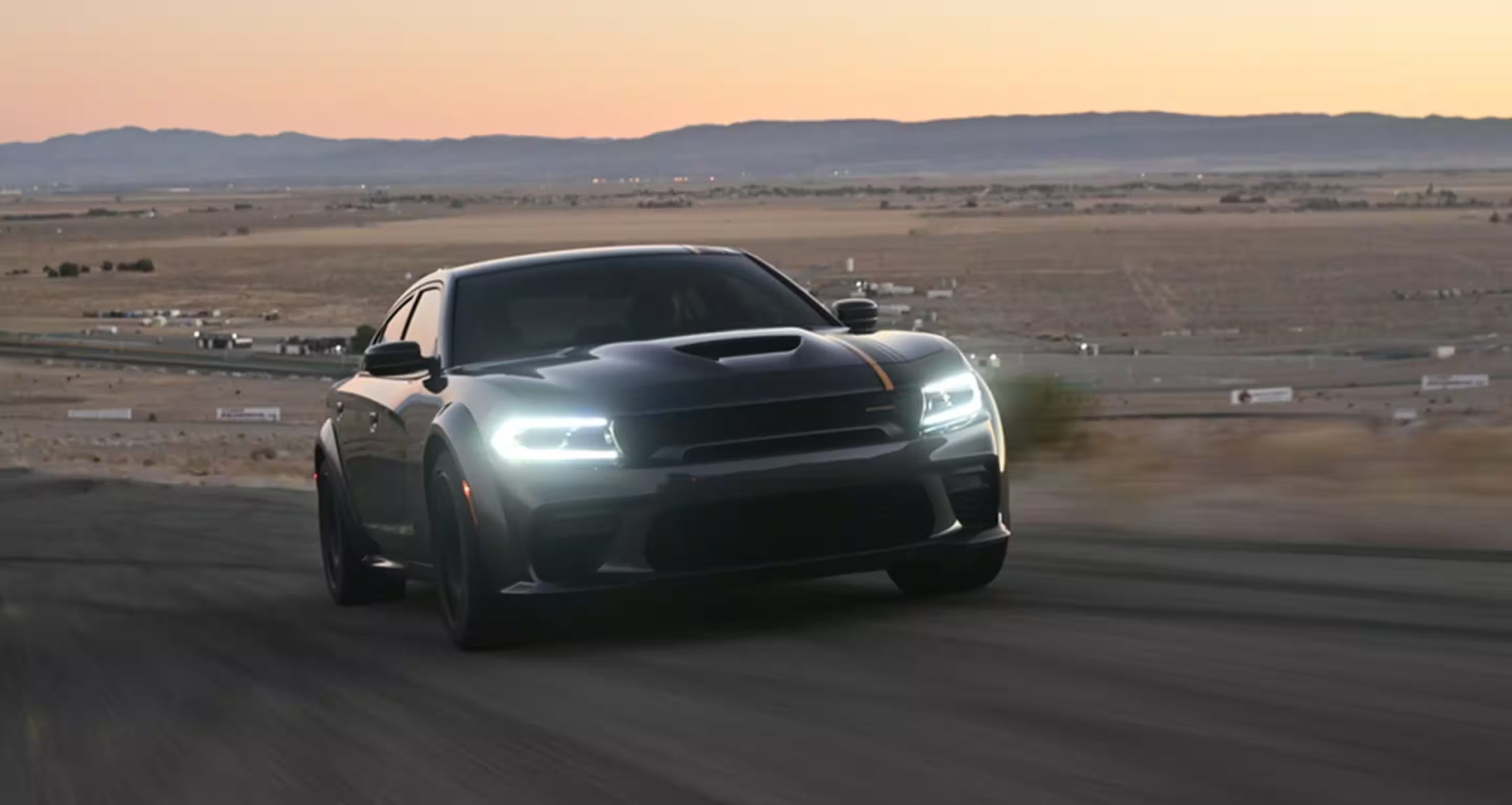 2023 Dodge Charger driving down a desert road
