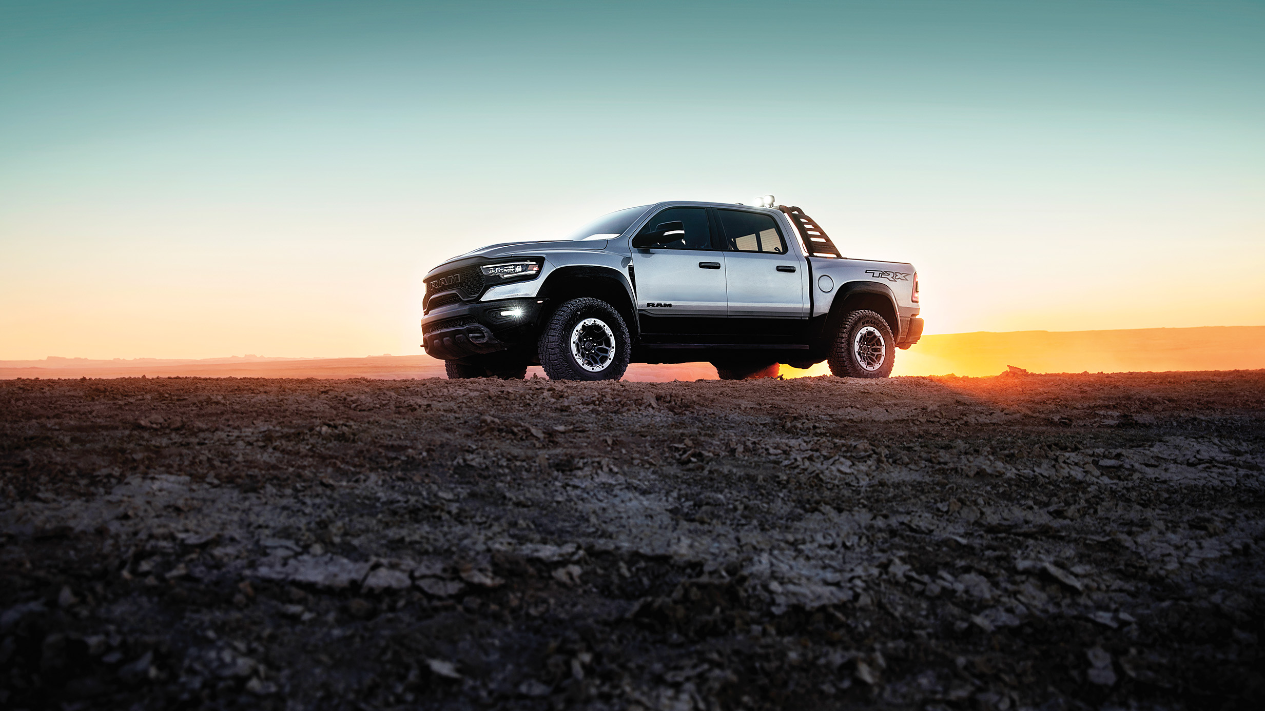 The 2023 RAM 1500 parked on the horizon, one truck that offers crew cab vs quad cab options